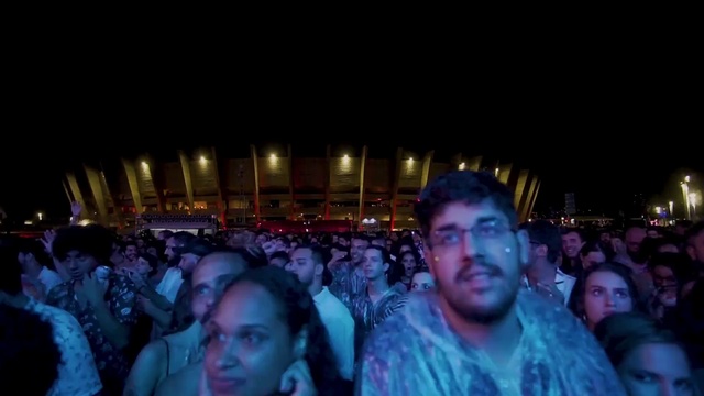 Video Reference: Crowd, People, Audience, Photograph, Social group, Fun, Event, Purple, Snapshot, Youth