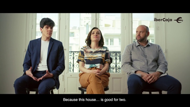 Video Reference: Sitting, Conversation, Fun, Adaptation, Photo caption, Screenshot, White-collar worker, Happy, Person, Man, Window, People, Group, Looking, Woman, Bench, Photo, Couple, Standing, Table, Holding, Talking, Train, Bus, Room, Clothing, Human face, Text, Smile, Suit
