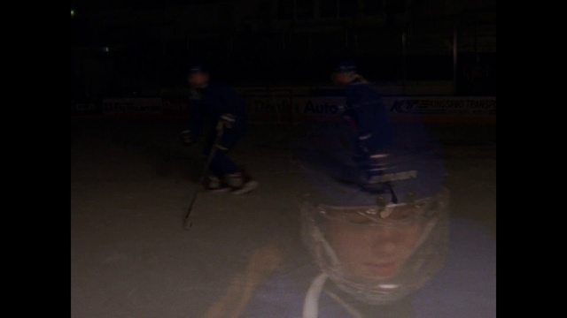 Video Reference: Black, Darkness, Light, Night, Midnight, Fun, Photography, Space, Performance, Performance art, Man, Dark, Front, Sitting, Table, Standing, Woman, Young, Computer, Room, Riding, Playing, White, Street, People, Ice skating, Hockey, Person, Clothing, Sports equipment, Human face