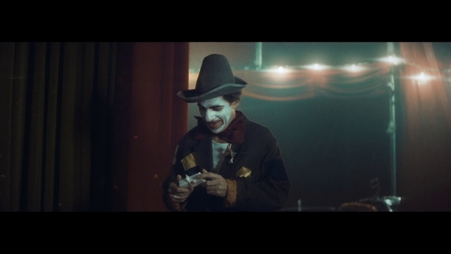 Video Reference: Music, Darkness, Music artist, Fun, Screenshot, Performance, Fictional character, Photography, Fedora, Movie