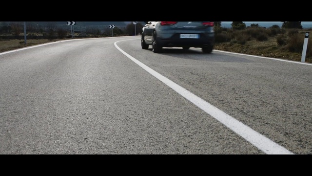 Video Reference: Land vehicle, Vehicle, Car, Road, Asphalt, Lane, Road surface, Personal luxury car, Automotive design, Mode of transport