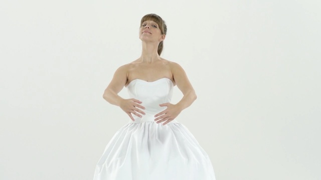 Video Reference: gown, dress, wedding dress, bridal clothing, beauty, shoulder, standing, photo shoot, fashion model, neck, Person