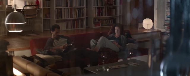 Video Reference: man, woman, low light room, window, rain, lamp, book, night, home