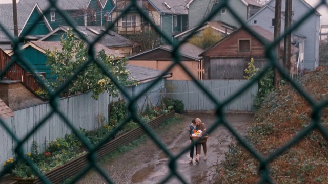 Video Reference: tree, plant, house, urban area, residential area, window, outdoor structure, fence, home, chain link fencing