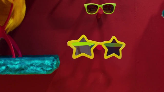 Video Reference: Green, Yellow, Red, Eyewear, Glasses, T-shirt, Font, Illustration, Graphic design, Symbol