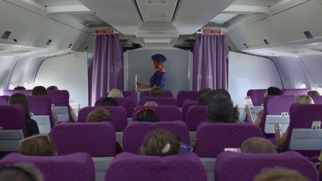 Video Reference: Purple, Aircraft cabin, Aisle, Airline, Interior design, Air travel, Vehicle, Function hall