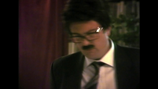 Video Reference: Suit, Hair, Photograph, Eyewear, Formal wear, Facial expression, Forehead, Gentleman, Male, Nose