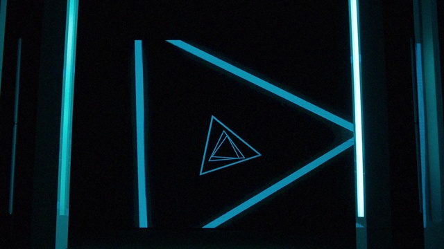 Video Reference: Black, Blue, Triangle, Font, Design, Electric blue, Graphic design, Graphics, Thing, Object, Monitor, Sitting, Screen, Front, Computer, Television, Laptop, Holding, Keyboard, Large, Player, Red, Cat, White, Remote, Man, Room, Light, Sign, Video, Screenshot, Line, Text, Abstract