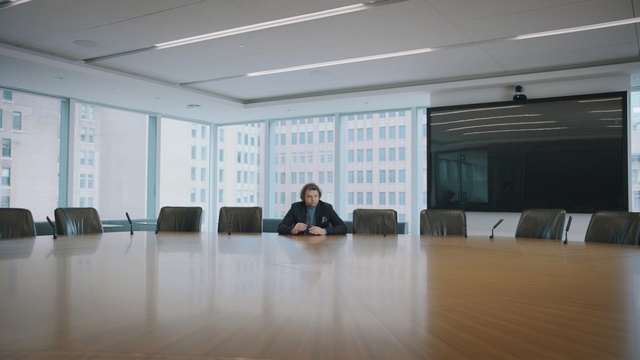 Video Reference: Floor, Office, Building, Room, Flooring, Sitting, Interior design, Conference hall, Architecture, Company, Person