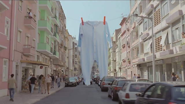 Video Reference: neighbourhood, town, street, infrastructure, urban area, city, building, downtown, residential area, road, Person