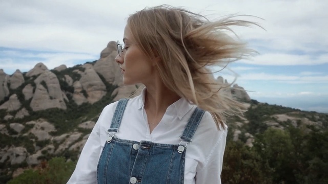 Video Reference: hair, human hair color, mountainous landforms, beauty, girl, hairstyle, outerwear, long hair, vacation, blond, Person