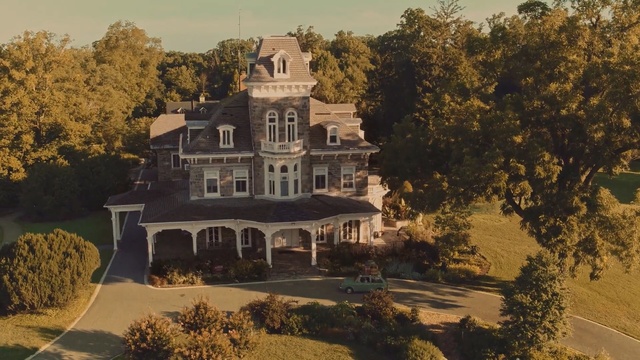 Video Reference: home, estate, mansion, property, house, stately home, real estate, tree, building, residential area, Person
