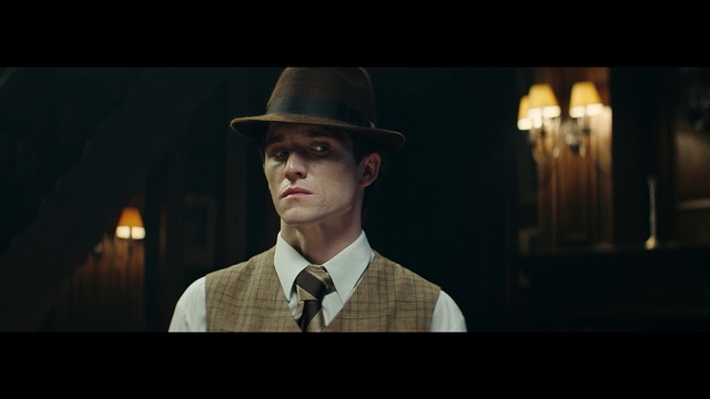 Video Reference: Fedora, Hat, Movie, Human, Headgear, Fashion accessory, Darkness, Photography, Screenshot, Flash photography