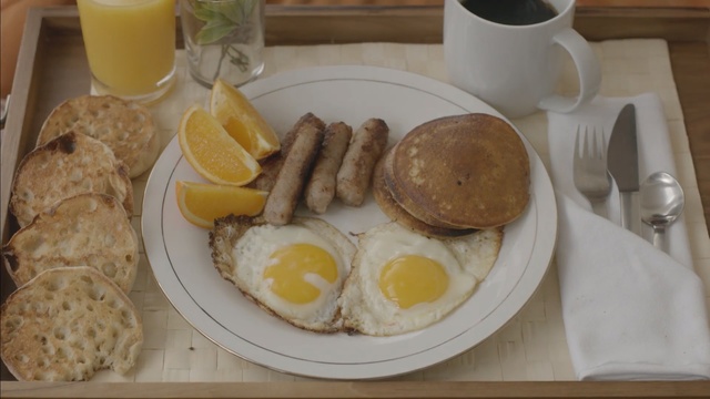 Video Reference: meal, breakfast, brunch, full breakfast, dish, fried egg, egg, food, lunch, Person