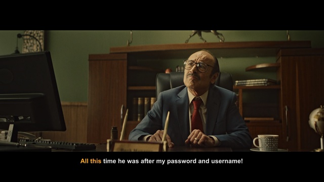 Video Reference: Screenshot, Photo caption, Conversation, Speech, Adaptation, Pianist, Public speaking, Official, Movie, Spokesperson, Person, Man, Indoor, Looking, Photo, Front, Suit, Sitting, Standing, Holding, Woman, Television, Monitor, Table, Wearing, Room, Screen, Mirror, Cat, Suitcase, Computer, Living, White, Text, Wall, Human face, Clothing