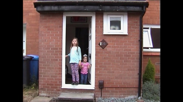 Video Reference: home, house, property, town, brickwork, door, window, neighbourhood, residential area, facade, Person