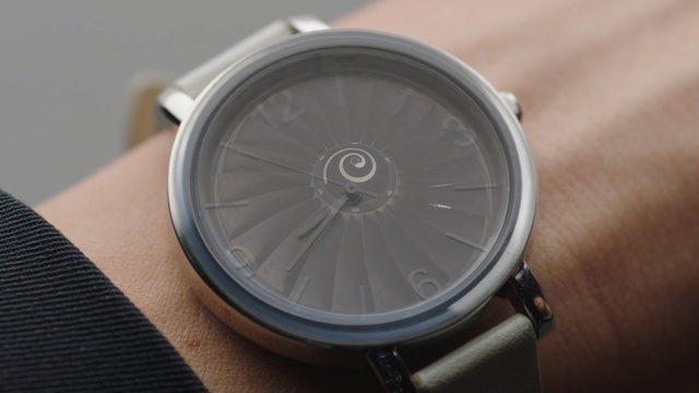 Video Reference: Analog watch, Watch, Watch accessory, Silver, Material property, Fashion accessory, Strap, Circle, Metal, Hardware accessory