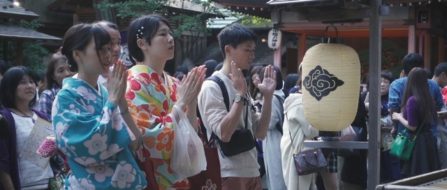 Video Reference: clothing, woman, public space, kimono, girl, temple, costume, street, city, Person