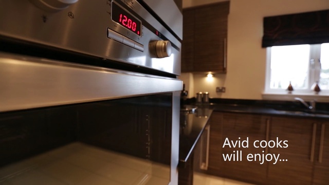 Video Reference: countertop, property, kitchen, interior design, under cabinet lighting, flooring, glass, floor, Person