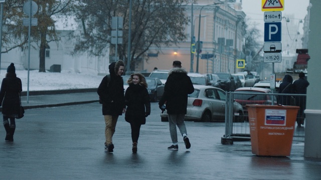 Video Reference: urban area, pedestrian, infrastructure, road, street, public space, city, snapshot, standing, winter, Person