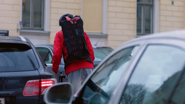 Video Reference: Vehicle door, Red, Vehicle, Car, Snapshot, Automotive exterior, Street fashion, Automotive window part, Pedestrian, Street, Person