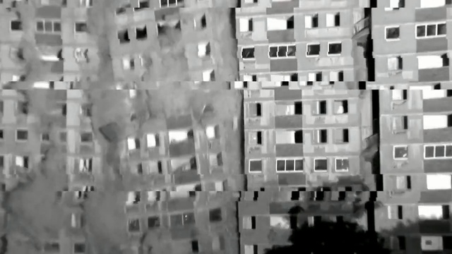 Video Reference: urban area, building, residential area, metropolis, landmark, tower block, black and white, black, metropolitan area, monochrome photography, Person
