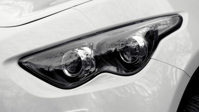 Video Reference: car, motor vehicle, white, automotive lighting, black, photograph, vehicle, automotive design, headlamp, family car