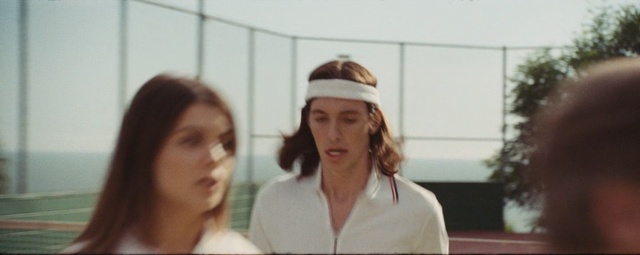 Video Reference: Fun, Headgear, Cap, Uniform, Person, Woman, Indoor, Standing, Lady, Looking, Front, Holding, Girl, Shirt, Cake, Young, Glasses, Mirror, Wine, Female, Kitchen, Table, Hair, Wearing, White, Red, Room, Teeth, Hat, Human face, Clothing, Smile