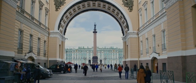 Video Reference: Landmark, Building, Architecture, Classical architecture, Arch, City, Human settlement, Plaza, Town square, Arcade, Person