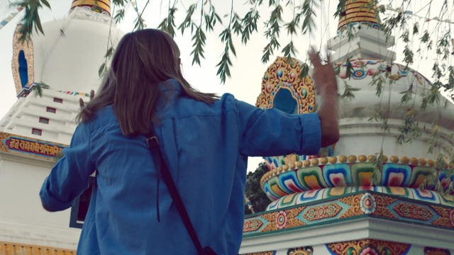 Video Reference: Place of worship, Textile, Temple, Sleeve, Vacation, World, Tourism, Leisure, Building, Jacket, Person