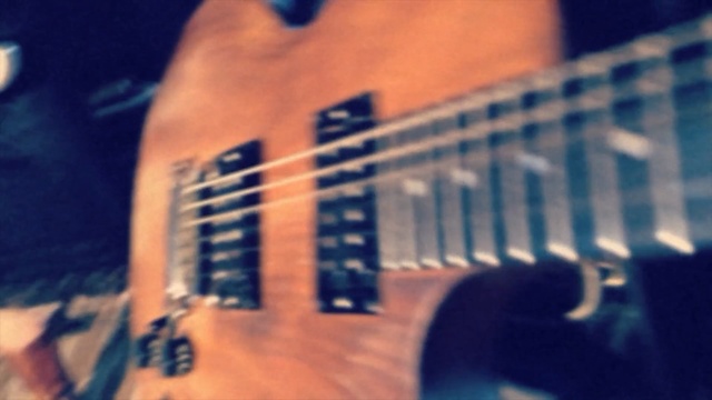 Video Reference: musical instrument, guitar, blue, string instrument, string instrument, bass guitar, plucked string instruments, string instrument accessory, electric guitar, finger, Person