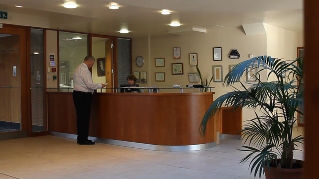 Video Reference: lobby, interior design, receptionist, furniture, floor, flooring, glass
