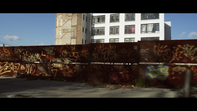 Video Reference: wall, urban area, graffiti, sky, residential area, mural, street art, neighbourhood, facade, screenshot