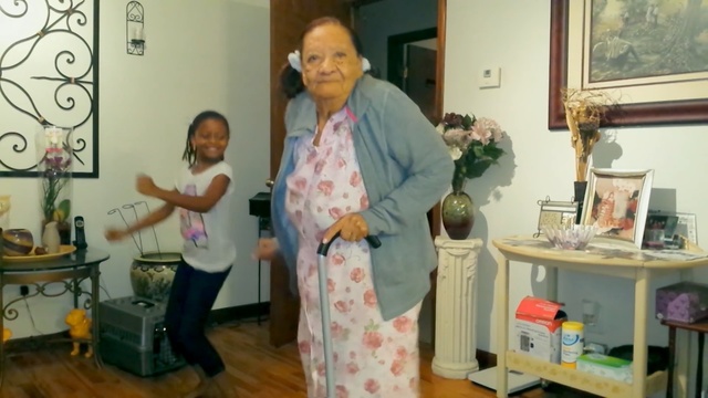 Video Reference: clothing, woman, room, senior citizen, costume, product, flower, girl, Person