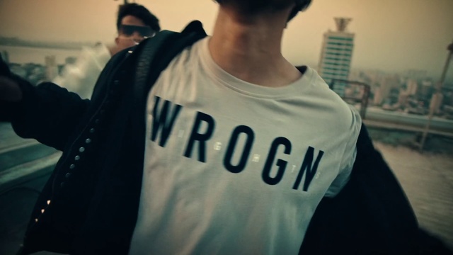 Video Reference: T-shirt, White, Cool, Shoulder, Font, Top, Outerwear, Shirt, Neck, Sleeve