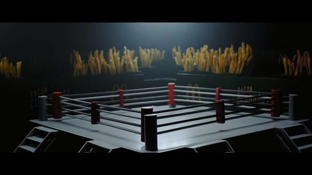 Video Reference: Sport venue, Boxing ring, Stage, Furniture, Table, Room, Boxing equipment, Contact sport, Darkness, Symmetry