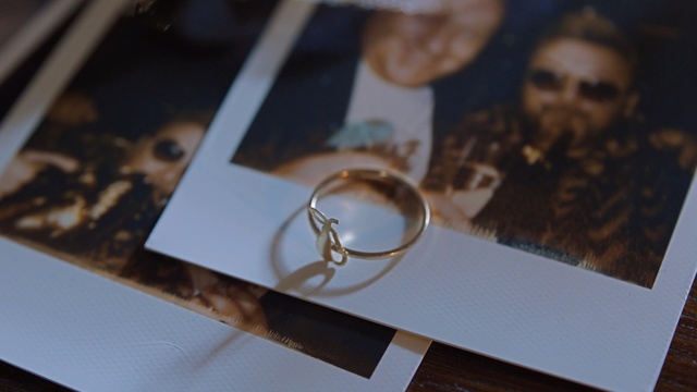 Video Reference: Jewellery, Fashion accessory, Ring, Material property, Wedding ring, Photography, Finger, Wedding ceremony supply, Circle, Metal, Person