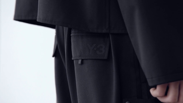 Video Reference: Clothing, Coat, Outerwear, Trench coat, Formal wear, Suit, Overcoat, Tuxedo, Academic dress, Collar