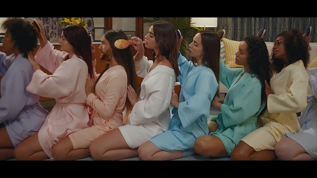 Video Reference: People, Youth, Event, Leg, Human body, Fun, Mouth, Sitting, Crowd, Uniform, Person, Group, Indoor, Woman, Wine, Large, Food, Table, Holding, White, Restaurant, Man, Standing, Human face, Clothing, Smile, Girl