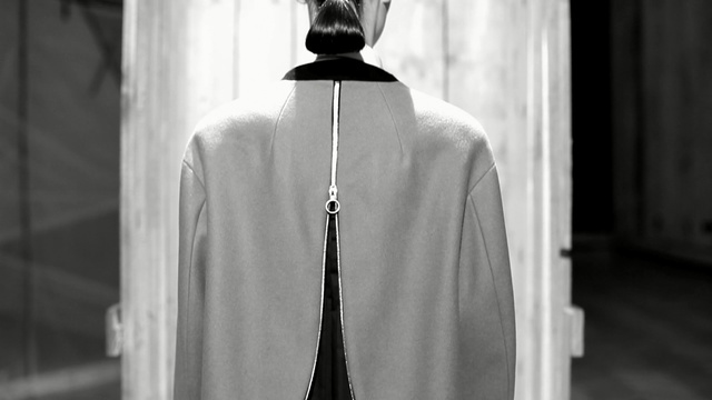 Video Reference: white, black, black and white, monochrome photography, outerwear, standing, photography, dress, shoulder, fashion