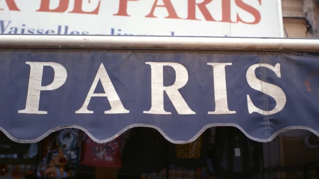 Video Reference: advertising, signage, banner, font, street sign, sign, automotive exterior, Person