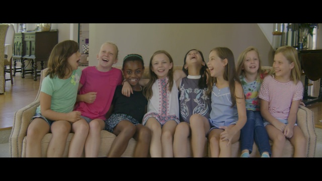 Video Reference: people, social group, girl, sitting, day, fun, beauty, room, child, youth, Person