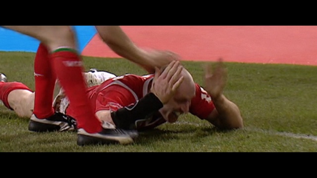 Video Reference: player, athletics, red, games, football player, footwear, sports, athlete, day, sport venue, Person