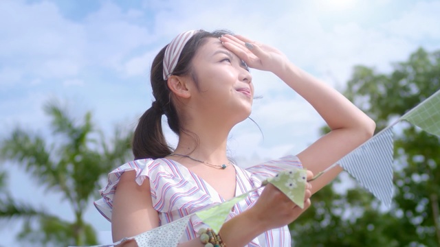 Video Reference: Hair, Skin, Lady, Beauty, Sunlight, Hairstyle, Summer, Happy, Arm, Shoulder, Person, Outdoor, Girl, Clothing, Woman, Holding, Young, Standing, Little, Posing, White, Riding, Wearing, Dress, Field, Board, Frisbee, Swinging, Yellow, Water, Playing, Umbrella, Court, Blue, Sky, Tree, Human face, Fashion accessory, Swimsuit