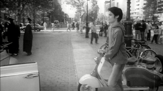 Video Reference: photograph, black and white, street, vehicle, monochrome photography, mode of transport, infrastructure, car, road, photography, Person