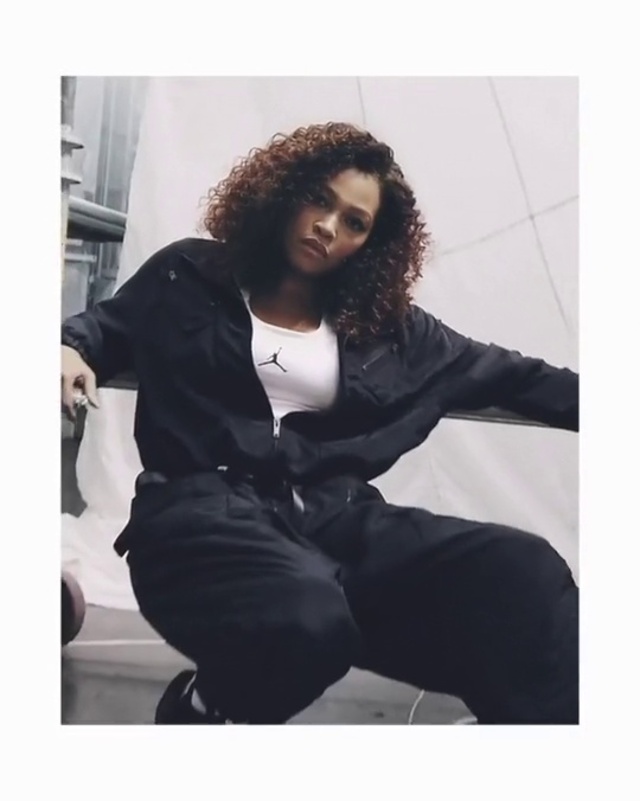 Video Reference: Hair, Black, Clothing, Beauty, Outerwear, Fashion, Hairstyle, Sitting, Suit, Jacket