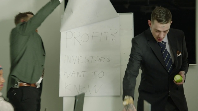 Video Reference: Suit, Formal wear, Green, Tuxedo, Standing, Fashion, Fun, Design, White-collar worker, Businessperson