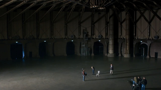 Video Reference: Stage, Architecture, Building, Arena, Field house, Theatre, Darkness, Performance, Sport venue, Person
