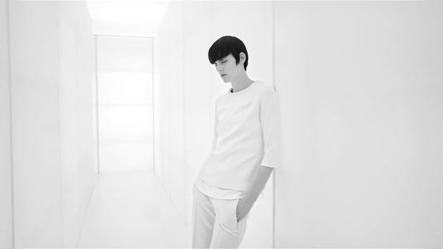 Video Reference: White, Shoulder, Standing, Neck, Black-and-white, Joint, Fashion, Photography, T-shirt, Room