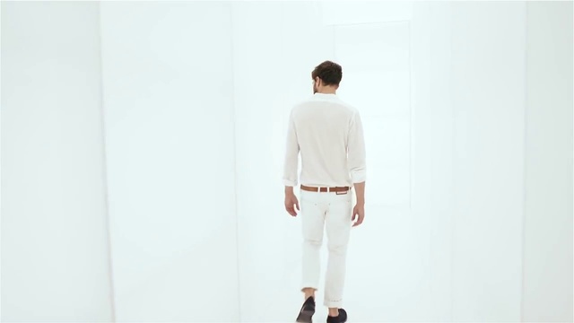 Video Reference: White, Clothing, Shoulder, Collar, Sleeve, Outerwear, Beige, Fashion, Neck, Standing